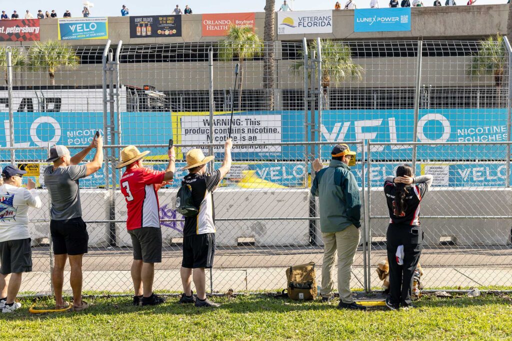 Fans watch IndyCar action through the safety fence at the Firestone Grand Prix of St Petersburg